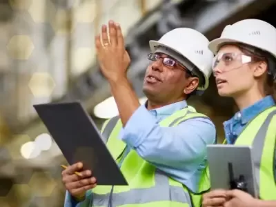 16x9-man-woman-wearing-safety-equipment-holding-tablets.2560-qzlsl58jyfgyntvyze15scv729481qxf2mcsjjx9yw